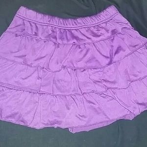 Girls purple stretchy ruffled skirt L/G